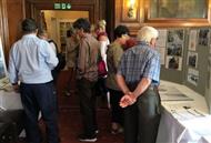 People examining a display