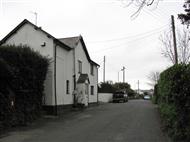 Wite-washed cottage beside the road